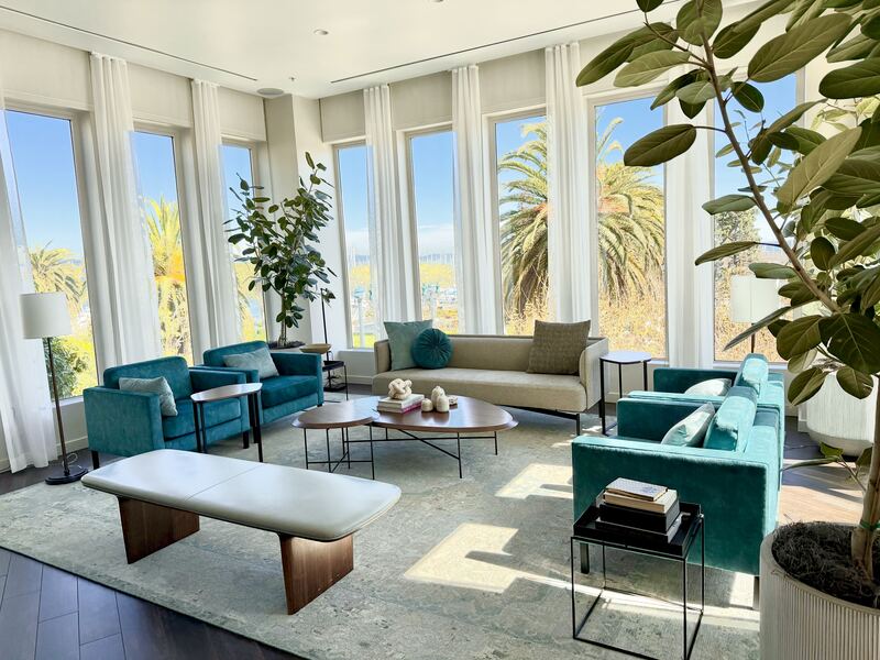 Lounge seating with palm tree views